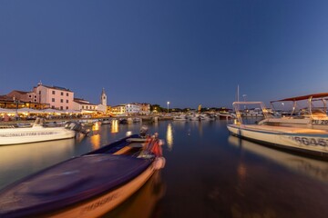 Picture over the harbor of Fazana in Istria in the evening during sunset