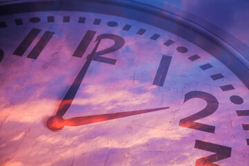 Clock and sunset sky, double exposure. Time concept