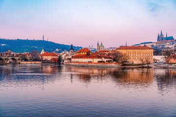 View of the city of Prague castle in hradcany and the Vltava river with Charles bridge in Prague, Czech Republic.