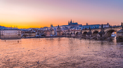 View of the city of Prague castle in hradcany and the Vltava river with Charles bridge in Prague, Czech Republic.