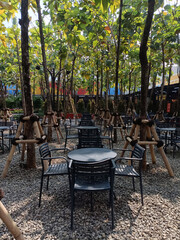 a restaurant with the concept of nature under teak trees