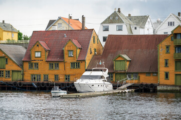 Quaint wooden buildings and boats on the harbourside of the Norwegian town of Haugesund