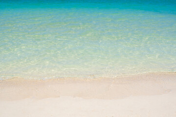 beautiful blue beach and sea calm relaxed wave on shore close-up copy space