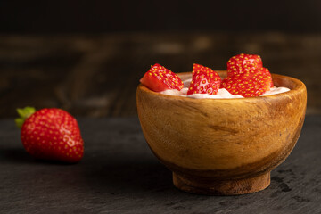 yogurt made from milk with added flavor and pieces of ripe strawberries