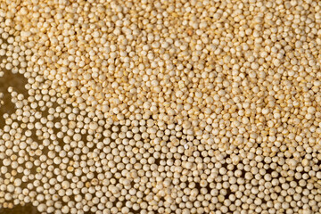 a large amount of quinoa porridge floats in clean water