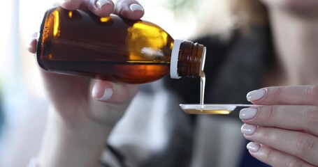 Hand holding suspension of liquid and syrup with additives closeup. Prevention of seasonal diseases health care and medicine. Nutritional supplements for treatment and prevention of diseases. Caring