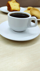 Cup of coffee in a traditional brazilian breakfast with copy space
