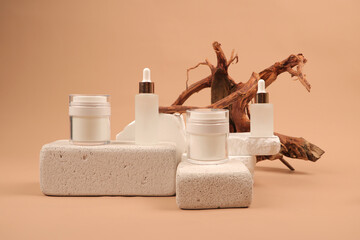 Elegant White Dropper and Jar Bottles on Textured Stone Display