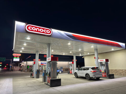 West Yellowstone, Montana,USA-June 14th 2024:  Conoco brand gas station at night