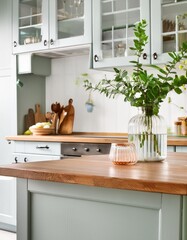 modern kitchen interior with wooden top ,white cabinet and cupboard with vase glass of green leaves branch 