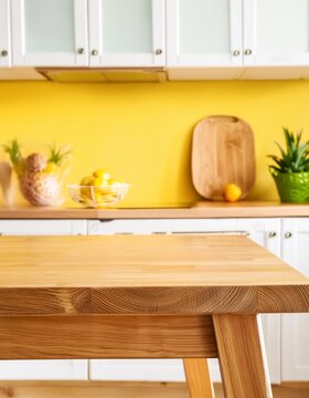Part of wood island table in yellow kitchen background ,mock-up stand for product