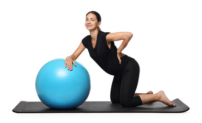 Beautiful pregnant woman with fitball doing exercises on mat against white background