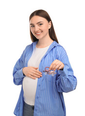 Expecting twins. Pregnant woman holding two pacifiers on white background