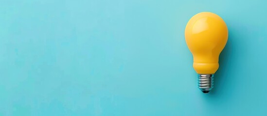 Yellow Lightbulb on Blue Background