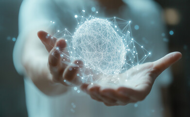 Fototapeta premium A glowing digital brain hologram suspended above an outstretched hand, symbolizing advanced technology and innovation.