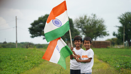 Cheerful indian little boy kids holding indian national flag, happy independence day, 15th of august, republic day, Protestantism concept.