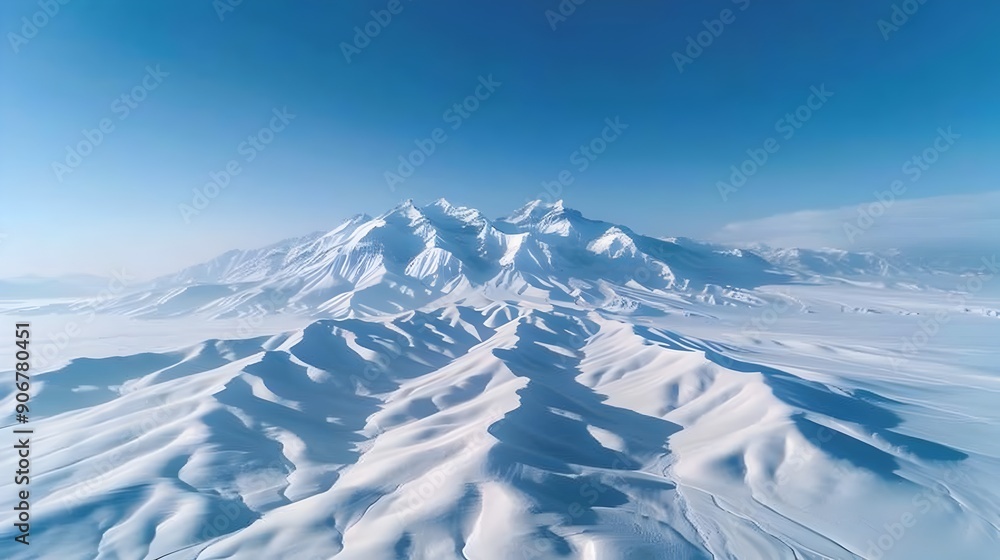 Sticker Breathtaking Aerial View of Pristine Snowy Mountain Peaks under Clear Blue Sky