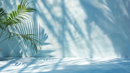 Minimal light blue background with tropical leaf shadows on plaster wall
