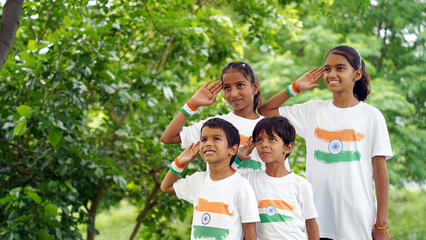 Group of happy Indian saluting indian tricolour flag and celebrating Independence day or Republic day.