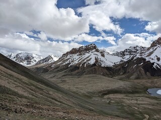 Fototapeta premium Breathtaking Views of Shimshal Pass in the Pamir Mountains. Shimshal Valley is a remote and breathtakingly beautiful area known for its high-altitude landscapes, rugged mountains, and many more.