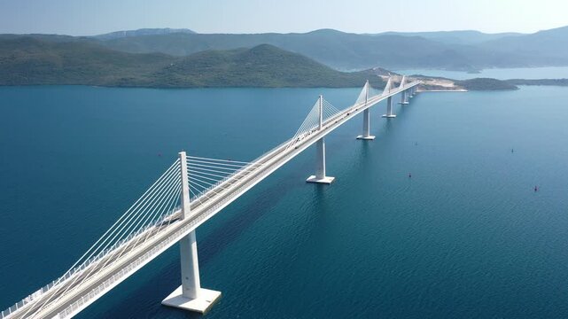 Soar above the magnificent Pelje&scaron;ac Bridge, connecting the mainland to the Pelje&scaron;ac peninsula, and witness a marvel of modern engineering.