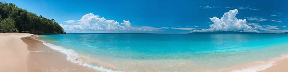 Fototapeta premium A beautiful beach with a clear blue ocean and a few clouds in the sky