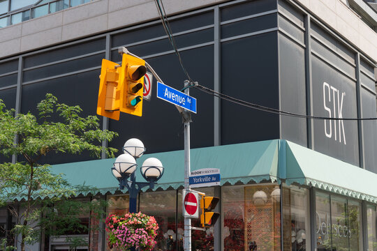 City of Toronto street sign at Yorkville Avenue at Avenue Road (featuring STK Steakhouse behind)