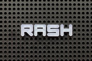 White color letter in word rash on black pegboard background
