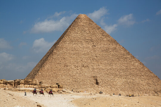 Tourists on Camels, Pyramid of Khafre (Chephren) in the background, Giza Pyramid Complex, UNESCO World Heritage Site, Giza, Egypt, North Africa, Africa