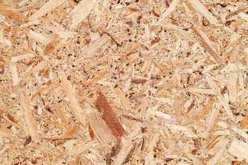 texture of wooden surface of pressed chips and sawdust, background