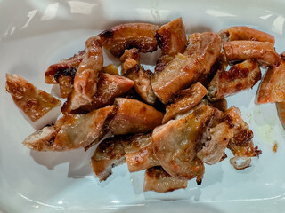 Grilled pork intestines cut into pieces. Exotic Thai food