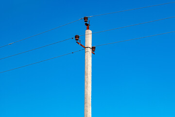 power electric pole with stretched wires.