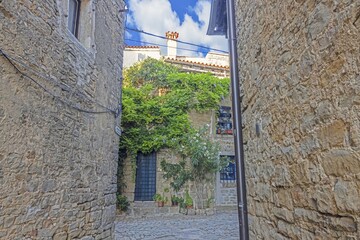 a doorway that leads to a room with a view to a street in the medieval