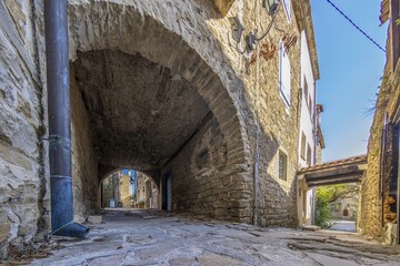 old, old alleyway with a blue sky in the background