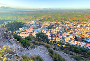 Town with Buildings, houses, streets. City building, aerial view. View of rooftops and streets of Almenara, Spain. Roofs of houses, drone view. Mountains landscape. Urban rooftop. Typical spanish city