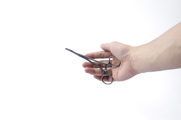 hand holding curved forceps surgical tool on white background, isolated photo