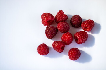 red raspberry on a white background