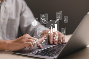 Concept of big data analysis and business intelligence. Businessman uses computer showing chart and...