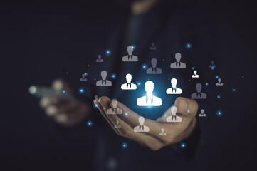 businessman uses AI technology for customer management to personalize interactions, predict...