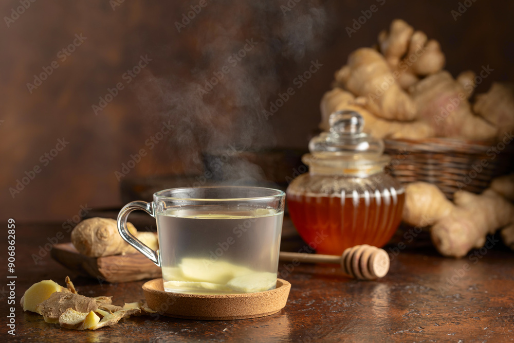 Wall mural ginger tea on a brown background.