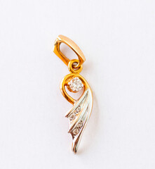 Close up shot of the golden pendant. Jewelery