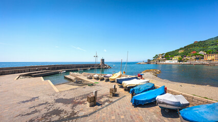 Boats on the seafront and the beach of Recco. Province of Genoa, Liguria, Italy