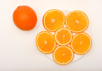 Sliced oranges on a white background. Chopped fruits.