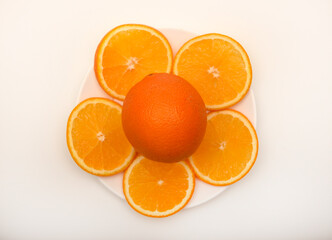 Sliced oranges on a white background. Chopped fruits.