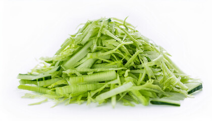 Heap of vibrant shredded green cucumber on isolated white. Tasty vegetable. Organic and fresh.