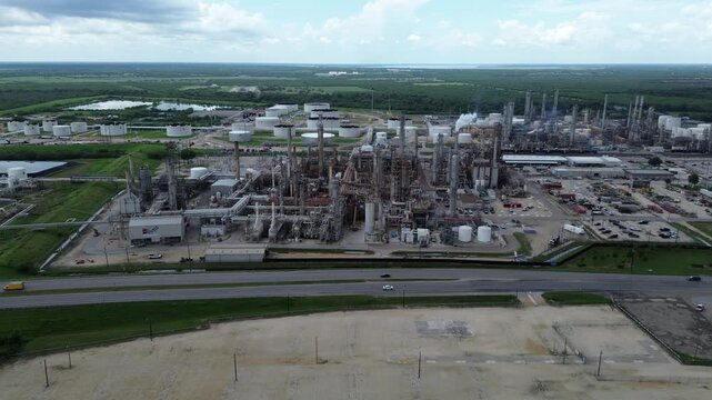 Working large oil refinery complex with crude oil distillation unit, storage tanks, utility systems, pipelines in agriculture agro-town San Antonio, Texas, produce gasoline, diesel, benzene, LPGs