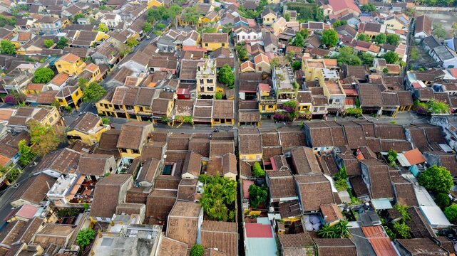 Aerial view of Hoi An's quaint rooftops showcasing traditional Vietnamese architecture and urban density issues