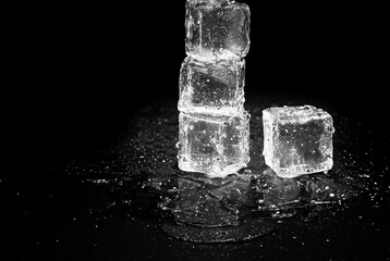 Reflective Ice Cubes on Black Table