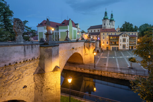 Klodzko, Poland - View of Gothic bridge over Mlynowka canal at dusk 