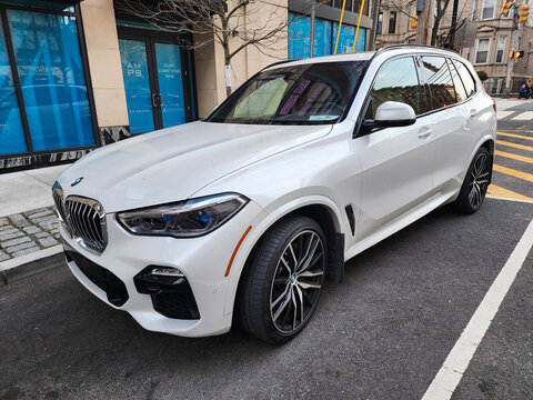 New York City, USA - February 10, 2024: 2019 BMW X5 SUV white car parked outdoor, side corner view